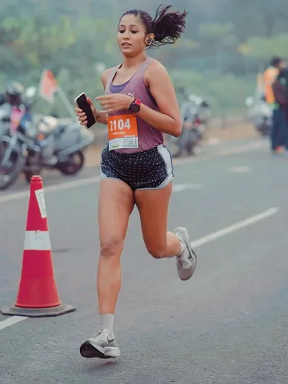 Be obsessed with chasing your dreams. A candid shot during a race, showing the determination and passion that drives every step.