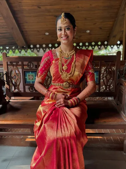 The bride seated on a swing, looking relaxed and radiant. My draping ensures comfort without compromising on elegance.