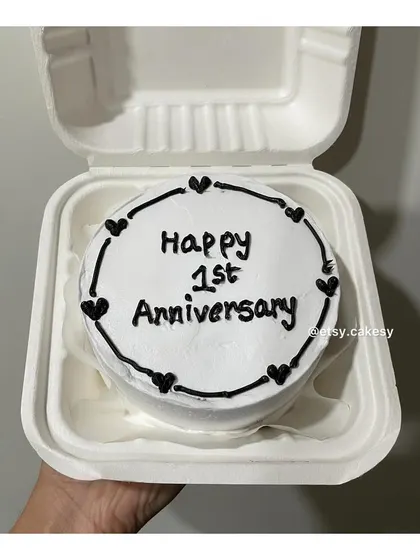 A clean and simple first-anniversary bento cake design.