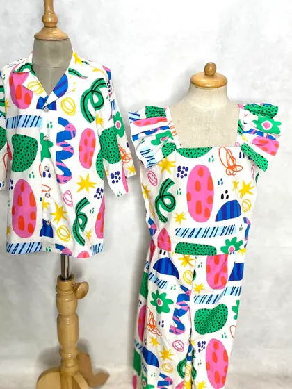 Fun and festive holiday looks for siblings. This abstract print is used to create a cool shirt for the brother and a matching dress with ruffled sleeves for the sister.