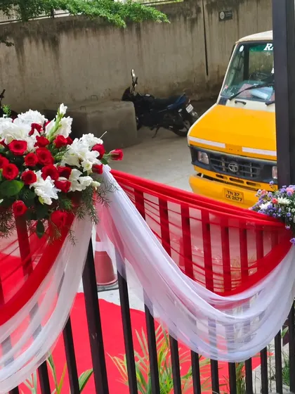 Another angle of the railing decor, showing how the drapes and flowers create a welcoming path along the entrance walkway.