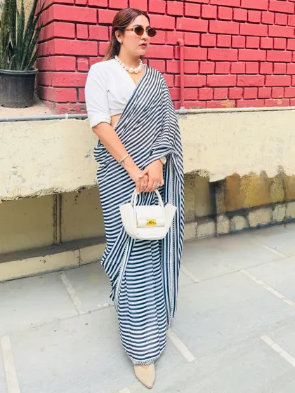 Another angle of my restyled trousseau saree. This look proves that you don't need new clothes to create a fresh look. It's all about creative styling and knowing how to mix and match pieces.
