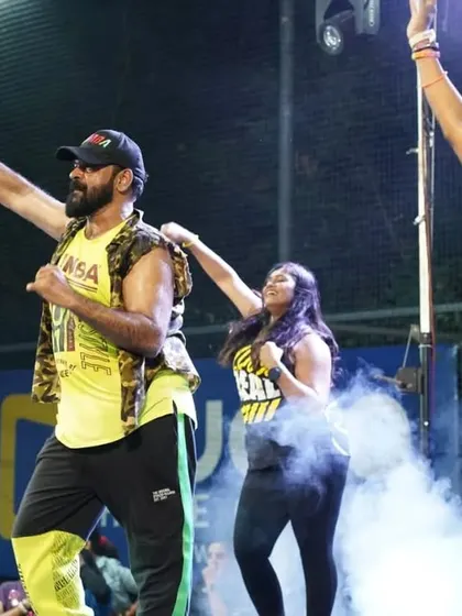 Leading the crowd with power and enthusiasm.