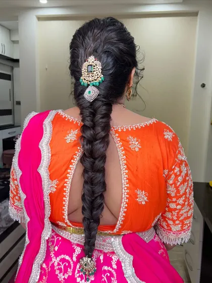 Another angle of the elegant fishtail braid, showing its thickness and the beautiful shine of the hair.