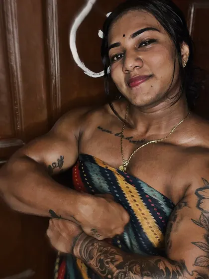 A slightly different angle of the 'Cutest Beast' pose, highlighting the striations and size of my arm muscles. This is the physique we build for the stage.