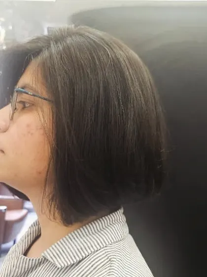 A side view of the classic bob, showing how it elegantly frames the face. This cut is versatile and effortlessly chic.