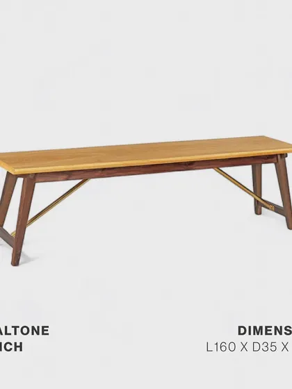 The Dualtone Bench, crafted from solid walnut and white oak with a distinctive brass stretcher. It is a versatile piece that adds warmth and sophistication, perfectly complementing our dining tables or serving as standalone seating.