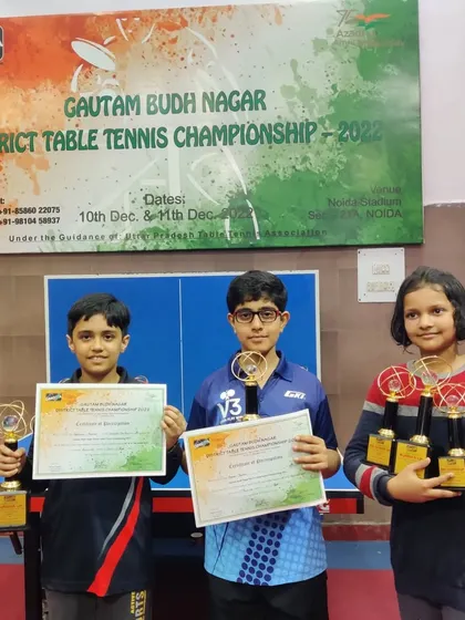 More smiling faces from the district championship. This young player proudly displays her three medals from the U-13, U-15, and U-17 categories.