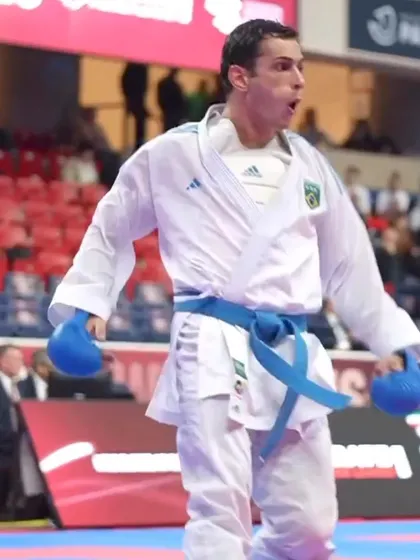 The raw emotion and focus of a competitor after scoring a point in a high-pressure match.