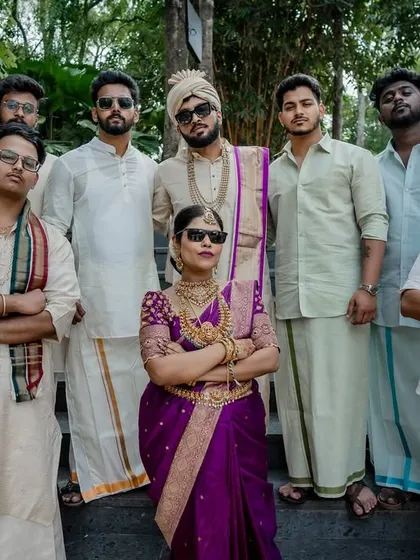The fun and games of wedding rituals. This moment of laughter during a post-wedding game shows the playful spirit and strong bond between the couple and their families.