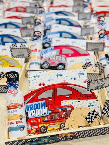 An army of car themed hampers ready for a birthday party. We can create these return gift sets in various colors and themes to match your event.