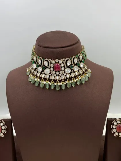 A close-up of our versatile floral stud earrings. These are available in multiple colors like emerald green and ruby red, and can be paired with many different necklaces.