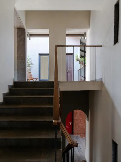The staircase at Maison Rouge, showing the view from the bottom landing up to the next level.