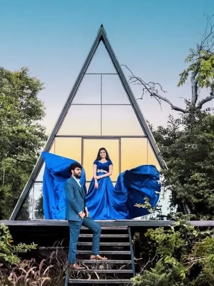 A modern fairytale. This couple chose our electric blue trail gown and a matching blue suit for their pre-wedding shoot at a unique architectural location.
