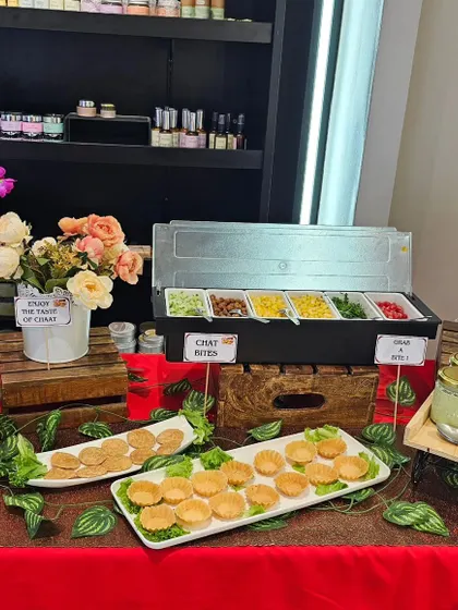 This hi-tea setup for a brand launch features an elegant chaat station. It's a great way to offer guests a light, flavorful snack while they mingle.