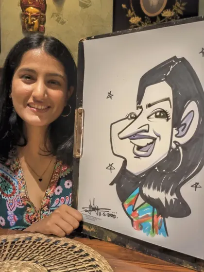 The patterns on her top were intricate and fun to suggest in the caricature. A great smile to capture.