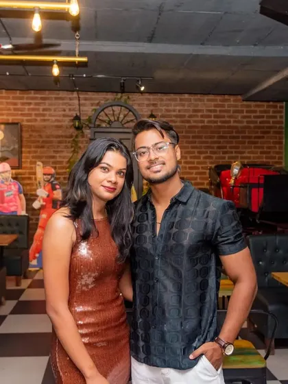 Another happy couple enjoying their night out. The checkered floors and brick walls are part of my signature interior style, creating a cool backdrop for your photos.