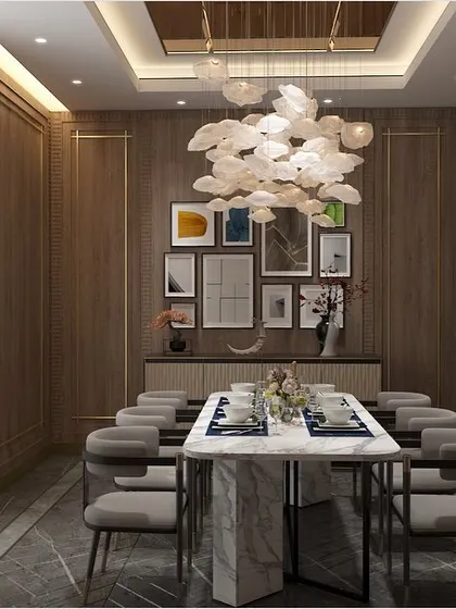 This dining area is infused with an understated yet modern spirit. I used wood-paneled walls, a gallery wall of art, and a cloud-like chandelier to create a space that feels both timeless and contemporary.
