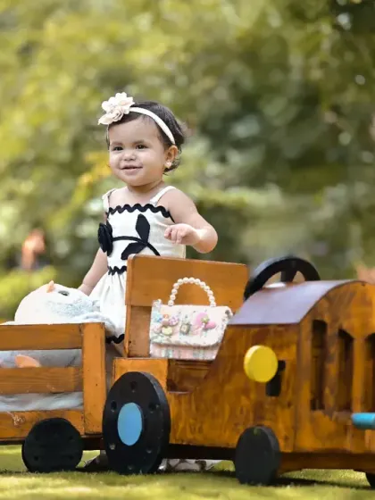 All aboard the teddy bear express for a first birthday adventure. I love taking shoots outdoors to use beautiful natural light. This custom-built train prop is just one of the many ways I bring big, imaginative ideas to life for your child's milestone celebration.