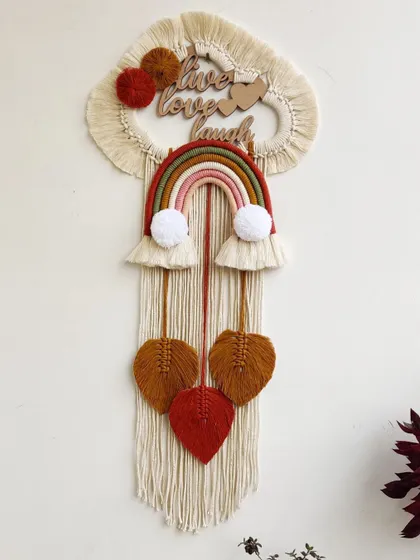 This "Live Love Laugh" rainbow hanging is a wonderful reminder to cherish every day. I made this for a couple, and the earthy rainbow tones and hanging leaves give it a warm, rustic feel.
