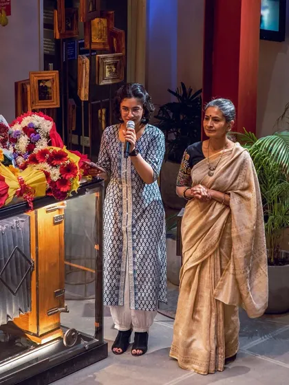 My student Ishana, who also helped emcee the event, standing with my mother. It is wonderful to see students take on leadership roles.