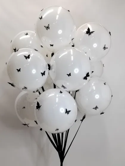 Our giant butterfly balloons make a real statement. This bunch of large white balloons is covered in delicate black butterfly decals for a simple but stunning effect.