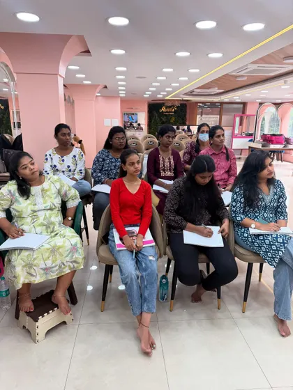 An attentive class during an advanced hairstyling demonstration.