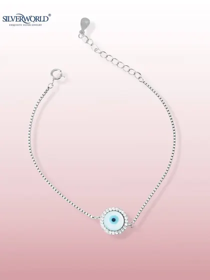 Our classic evil eye bracelet, featuring a single charm with a zirconia halo on a delicate box chain. This piece is crafted for style and subtle strength.