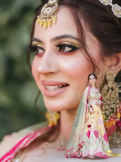 A beautiful portrait of the bride from her Haldi ceremony, highlighting her makeup and floral accessories.