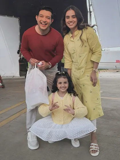 A happy moment on set with my on-screen family for a commercial shoot. Working with other actors, especially kids, requires a positive and patient attitude, which I always bring to the set. It's all about creating a believable and cheerful family dynamic.