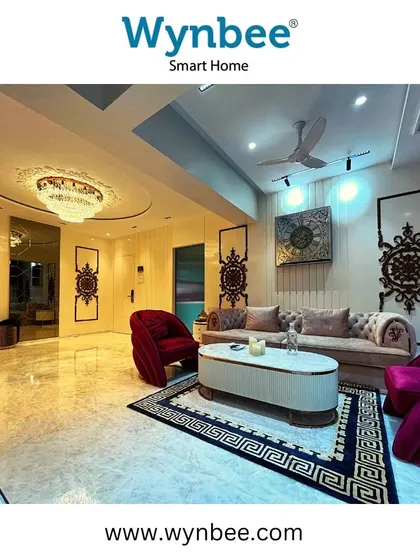 In this luxurious living room, I used a combination of a grand chandelier, recessed spotlights, and wall sconces to create the perfect ambiance. All lighting is fully automated and controllable to suit any occasion.