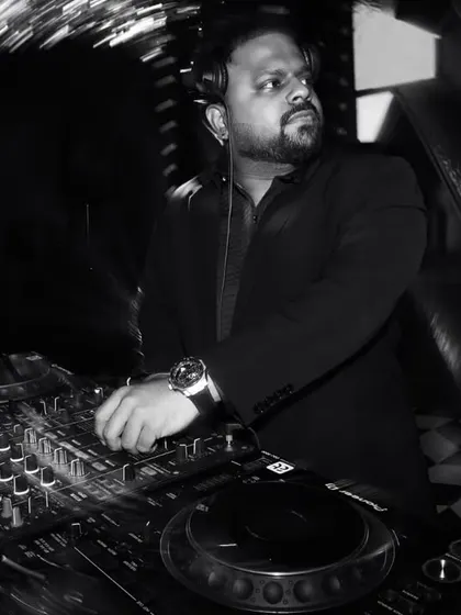A black and white shot of me at the decks during a wedding party. The focus is always on the craft, carefully curating the sound for the night.