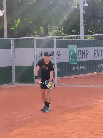 Preparing to return a serve. Anticipation and readiness are key skills we drill into our players.