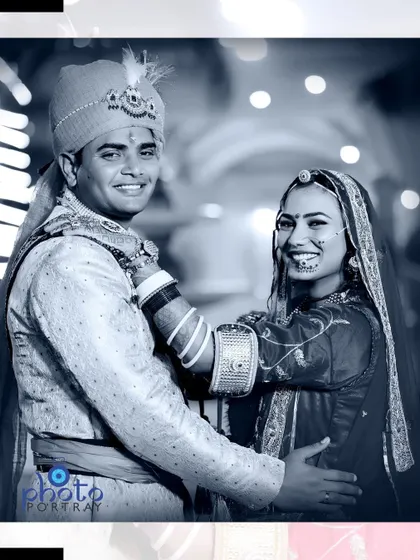 A playful, happy moment between the couple, presented in a beautiful black and white album-style edit.