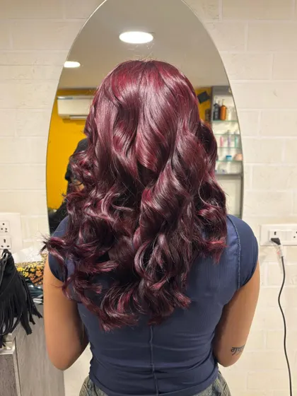 This deep wine or burgundy shade is a fantastic choice for Indian skin tones. It's a bold yet elegant colour, and when styled with soft curls, it reveals beautiful dimension and richness.