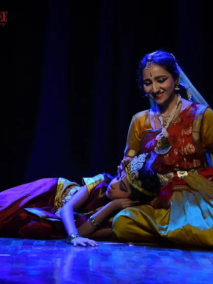 A tender moment on stage between two performers during our Nritya Sanje showcase, telling a story through their dance.