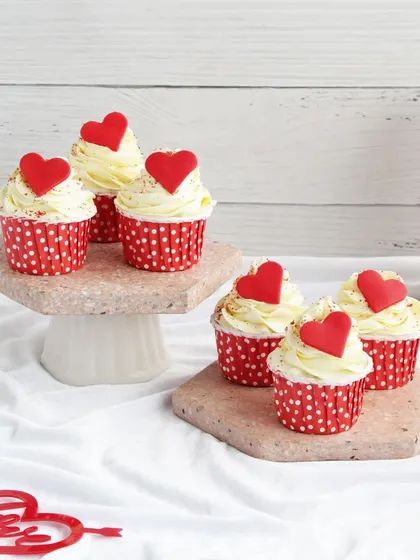Simple and sweet. Our vanilla cupcakes with red heart toppers are a classic Valentine's gesture, perfect for expressing your love.
