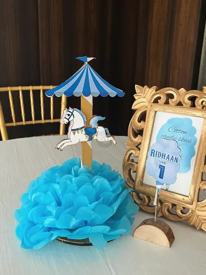 Another beautiful carousel centerpiece, perfect for a pastel-themed carnival party.