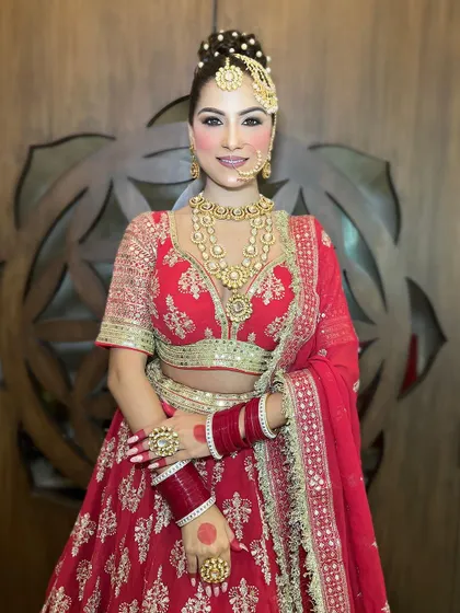 A smiling bride in her full wedding attire, showing how our rental pieces come together to create a joyful and complete bridal look.