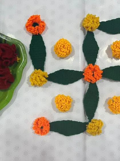 Here are some flowers and leaves I prepared for a 'Rukhwat' display, arranged in a swastik. These flowers always remain fresh and are perfect for creating auspicious symbols.