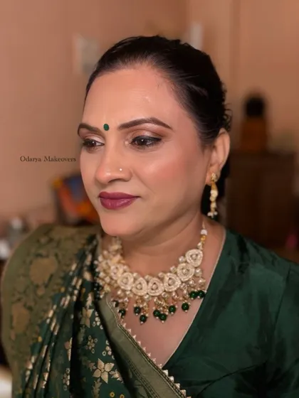 A side profile of the mature skin makeup, showing the soft contouring and the beautiful shimmer on her eyelids.