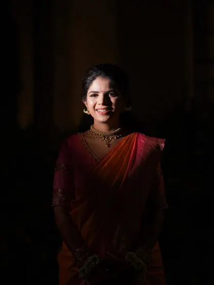 Another artistic low-key portrait of the bride. This style creates a timeless and elegant look, focusing solely on her happy expression.
