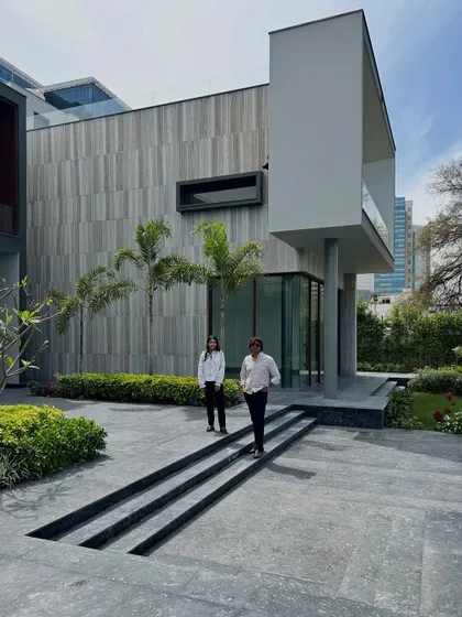 A moment captured with our co-founders at the Rosewood Farmhouse. The grand scale of the architecture and the carefully planned landscape behind them showcase the ambitious scope of our residential projects.