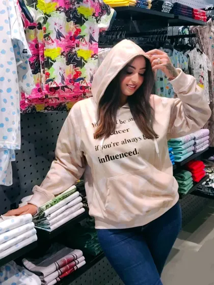 A duplicate of image 96, the influencer-themed hoodie.