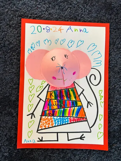 Anna's mouse, complete with a rainbow dress and a background full of hearts. So sweet!