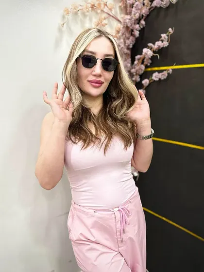 This client is rocking a trendy blonde look with dark roots and bright, face-framing money pieces. It's a bold yet wearable style that highlights her features.