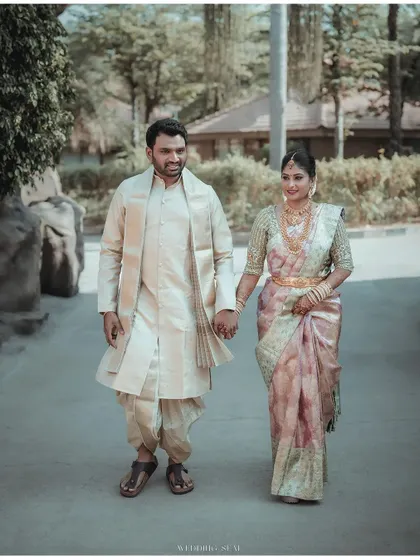 Hand in hand, they walk forward. This is a simple yet powerful image that symbolizes the start of their shared journey, captured with a focus on their connection.