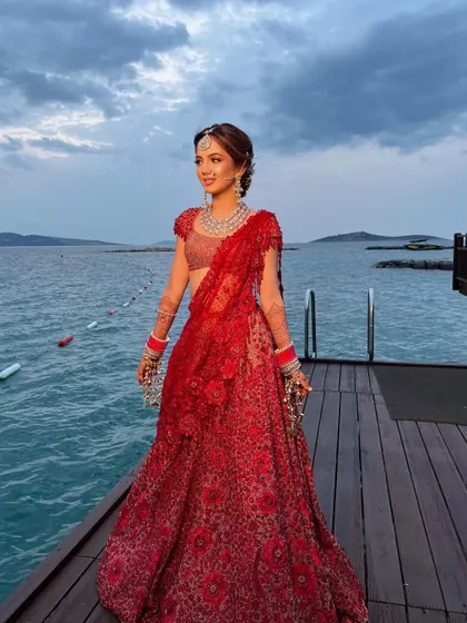 The bride enjoying the twilight, her hair perfectly styled in a romantic and soft updo.