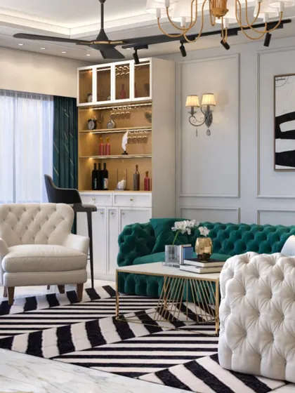 This living room exudes glamour with its black-and-white striped rug, tufted green sofa, and a dedicated bar corner. It's a space designed for sophisticated entertaining.