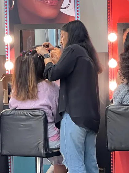 A shot of me working backstage. Being prompt and prepared is key, especially when working on projects with tight schedules and multiple looks.